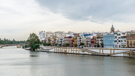 Guadalquivir river coast and architecture of Seville, Andalusia, Spain.の写真素材
