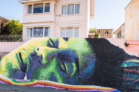 VALPARAISO, CHILE - NOV 9, 2014: Colourful graffiti on a house in Valparaiso, Chile. Valparaiso Historic centre is a UNESCO world heritage siteのeditorial素材