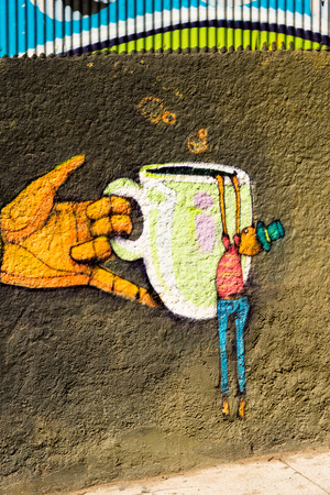 VALPARAISO, CHILE - NOV 9, 2014: Colourful graffiti on a house in Valparaiso, Chile. Valparaiso Historic centre is a UNESCO world heritage siteのeditorial素材