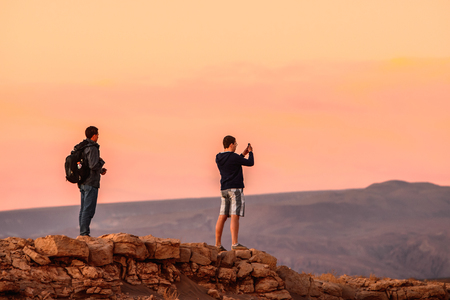 ATACAMA DESERT, CHILE - NOV 3, 2014: Unidentified tourists make pictures in the Atacama desert, Chile. Atacama Desert proper occupies 105,000 square kilometresのeditorial素材