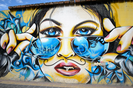 OTAVALO, ECUADOR - JAN 7, 2015: Graffiti on the houses of Otavalo, Ecuador. Otavalo is the  capital of Otavalo Canton, Imbabura Province of Ecuadorのeditorial素材