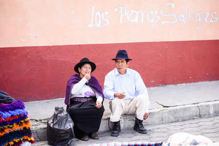 OTAVALO, ECUADOR - JAN 3, 2015: Unidentified Ecuadorian woman and man in bowler hats at the Otavalo Market. 71,9% of Ecuadorian people belong to the Mestizo ethnic groupのeditorial素材