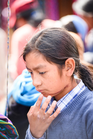 OTAVALO, ECUADOR - JAN 3, 2015: Unidentified Ecuadorian girl at the Otavalo Market. 71,9% of Ecuadorian people belong to the Mestizo ethnic groupのeditorial素材