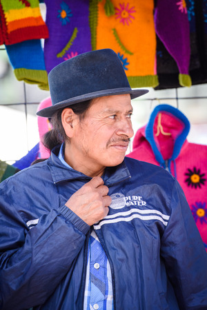 OTAVALO, ECUADOR - JAN 3, 2015: Unidentified Ecuadorian man in a hat at the Otavalo Market. 71,9% of Ecuadorian people belong to the Mestizo ethnic groupのeditorial素材