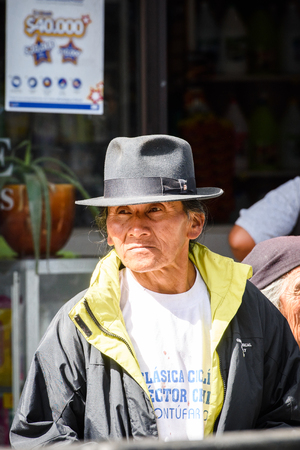 OTAVALO, ECUADOR - JAN 3, 2015: Unidentified Ecuadorian woman in a bowler in the street. 71,9% of Ecuadorian people belong to the Mestizo ethnic groupのeditorial素材