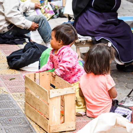 OTAVALO, ECUADOR - JAN 3, 2015: Unidentified Ecuadorian little girl at the Otavalo Market. 71,9% of Ecuadorian people belong to the Mestizo ethnic groupのeditorial素材