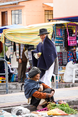 OTAVALO, ECUADOR - JAN 3, 2015: Unidentified Ecuadorian woman works at the Otavalo Market. 71,9% of Ecuadorian people belong to the Mestizo ethnic groupのeditorial素材