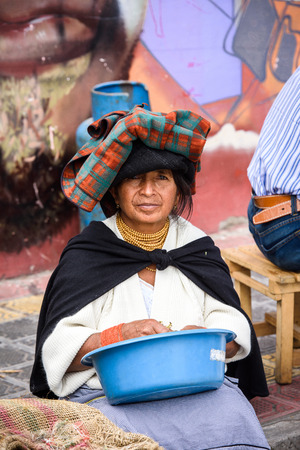 OTAVALO, ECUADOR - JAN 3, 2015: Unidentified Ecuadorian woman in traditional clothes at the Otavalo Market. 71,9% of Ecuadorian people belong to the Mestizo ethnic groupのeditorial素材
