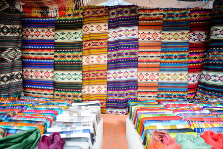 OTAVALO, ECUADOR - JAN 7, 2015: Colorful Souvenirs of the Otavalo market  designed and built in 1970 by Dutch architect Tonny Zwolloのeditorial素材