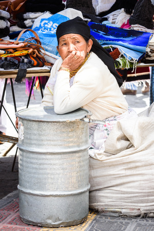 OTAVALO, ECUADOR - JAN 3, 2015: Unidentified Ecuadorian woman in traditional clothes at the Otavalo Market. 71,9% of Ecuadorian people belong to the Mestizo ethnic groupのeditorial素材