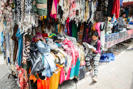 OTAVALO, ECUADOR - JAN 7, 2015: Colorful Souvenirs of the Otavalo market  designed and built in 1970 by Dutch architect Tonny Zwolloのeditorial素材