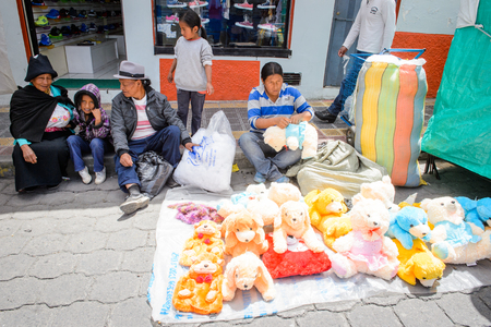 OTAVALO, ECUADOR - JAN 7, 2015: Colorful Souvenirs of the Otavalo market  designed and built in 1970 by Dutch architect Tonny Zwolloのeditorial素材