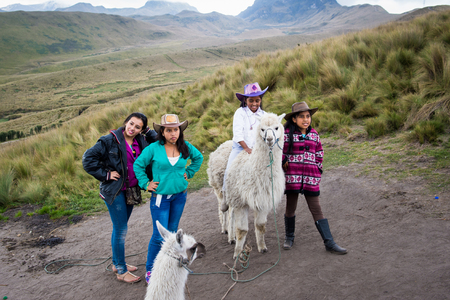 QUITO, ECUADOR - JAN 2, 2015: Unidentified Ecuadorian girls with lama . 71,9% of Ecuadorian people belong to the Mestizo ethnic groupのeditorial素材