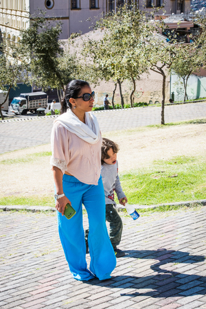 QUITO, ECUADOR - JAN 2, 2015: Unidentified Ecuadorian woman with her daugher. 71,9% of Ecuadorian people belong to the Mestizo ethnic groupのeditorial素材
