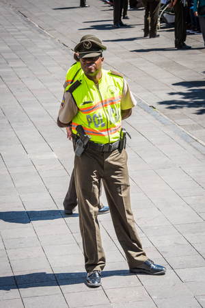 QUITO, ECUADOR - JAN 2, 2015: Unidentified Ecuadorian policeman. 71,9% of Ecuadorian people belong to the Mestizo ethnic groupのeditorial素材