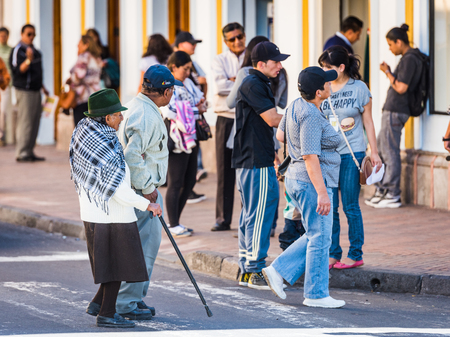 QUITO, ECUADOR - JAN 2, 2015: Unidentified Ecuadorian people in the street. 71,9% of Ecuadorian people belong to the Mestizo ethnic groupのeditorial素材