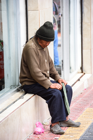 OTAVALO, ECUADOR - JAN 3, 2015: Unidentified Ecuadorian man in a hat at the Otavalo Market. 71,9% of Ecuadorian people belong to the Mestizo ethnic groupのeditorial素材