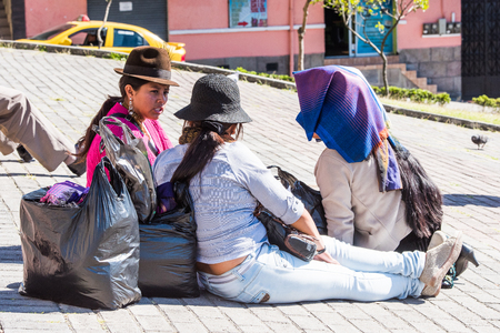QUITO, ECUADOR - JAN 2, 2015: Unidentified Ecuadorian women with bowler hats. 71,9% of Ecuadorian people belong to the Mestizo ethnic groupのeditorial素材
