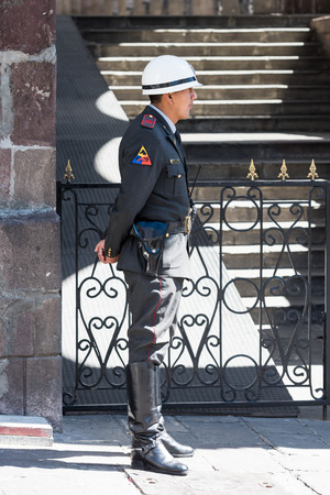 QUITO, ECUADOR - JAN 2, 2015: Unidentified Ecuadorian policemen. 71,9% of Ecuadorian people belong to the Mestizo ethnic groupのeditorial素材