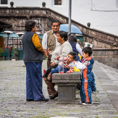 QUITO, ECUADOR - JAN 2, 2015: Unidentified Ecuadorian people in the street. 71,9% of Ecuadorian people belong to the Mestizo ethnic groupのeditorial素材