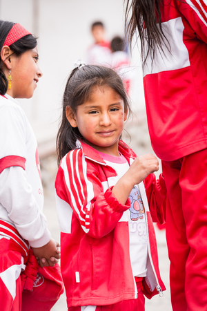 CUENCA, ECUADOR - JAN 9, 2015: Unidentified Ecuadorian children in sport clothes look through the telescope. 71,9% of Ecuadorian people belong to the Mestizo ethnic groupのeditorial素材