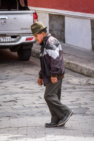 RIOBAMBA, ECUADOR - JAN 9, 2015: Unidentified Ecuadorian old man walks in the street. 71,9% of Ecuadorian people belong to the Mestizo ethnic groupのeditorial素材