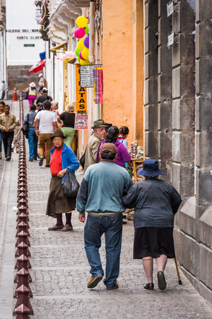 QUITO, ECUADOR - JAN 2, 2015: Unidentified Ecuadorian people in the street. 71,9% of Ecuadorian people belong to the Mestizo ethnic groupのeditorial素材
