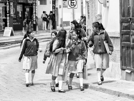 QUITO, ECUADOR - JAN 1, 2015: Unidentified Ecuadorian students in a school uniform. 71,9% of Ecuadorian people belong to the Mestizo ethnic groupのeditorial素材