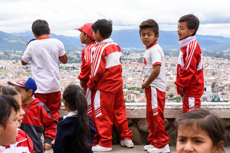 CUENCA, ECUADOR - JAN 9, 2015: Unidentified Ecuadorian children in sport clothes look through the telescope. 71,9% of Ecuadorian people belong to the Mestizo ethnic groupのeditorial素材