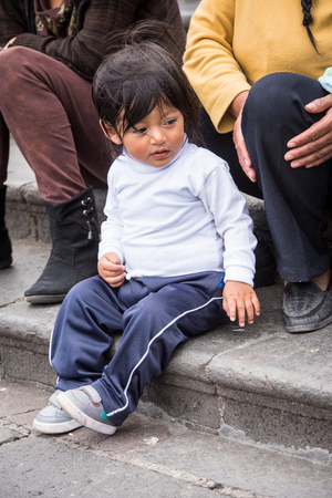 QUITO, ECUADOR - JAN 2, 2015: Unidentified Ecuadorian little girl. 71,9% of Ecuadorian people belong to the Mestizo ethnic groupのeditorial素材
