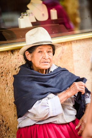 CUENCA, ECUADOR - JAN 9, 2015: Unidentified Ecuadorian woman in traditional clothes in the street. 71,9% of Ecuadorian people belong to the Mestizo ethnic groupのeditorial素材