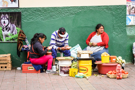 CUENCA, ECUADOR - JAN 9, 2015: Unidentified Ecuadorian people in the street. 71,9% of Ecuadorian people belong to the Mestizo ethnic groupのeditorial素材