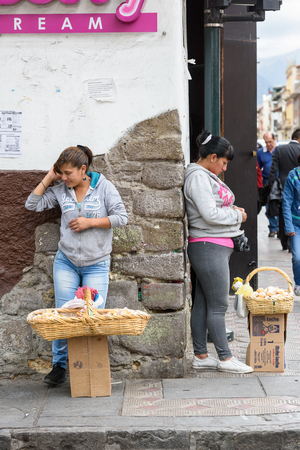 QUITO, ECUADOR - JAN 1, 2015: Unidentified Ecuadorian woman sells food in the street. 71,9% of Ecuadorian people belong to the Mestizo ethnic groupのeditorial素材