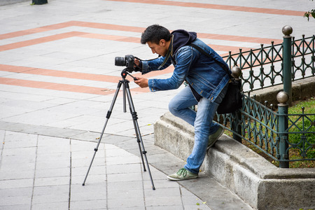 CUENCA, ECUADOR - JAN 9, 2015: Unidentified Ecuadorian man establish camera. 71,9% of Ecuadorian people belong to the Mestizo ethnic groupのeditorial素材