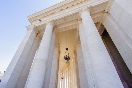 Lamp among the columns on the Saint Peter's square in Rome, Italyの写真素材