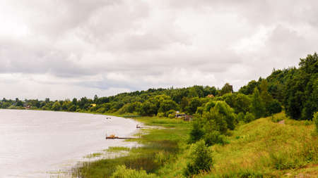 Green nature, plants, cloudy sky, river, outdoor, rain.の写真素材