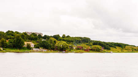 Green nature, plants, cloudy sky, river, outdoor, rain.の写真素材