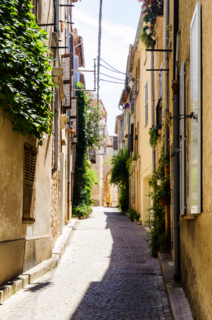 Street in the Old town of Antibes, Cote d'Azur, France. Antibes was founded as a 5th-century BC Greek colony and was called Antipolisの写真素材