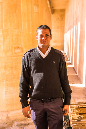 LUXOR, EGYPT - NOV 29, 2014: Unidentified Egyptian armed guardian at the Queen Hatshepsut's temple (Dayr el-Bahari or Dayr el-Bahri), part of the Theban Necropolis.のeditorial素材