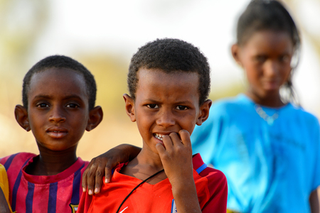 FERLO DESERT, SENEGAL - APR 25, 2017: Unidentified Fulani little boy puts his fingers into his mouth. Fulanis (Peul) are the largest tribe in West African savannahsのeditorial素材