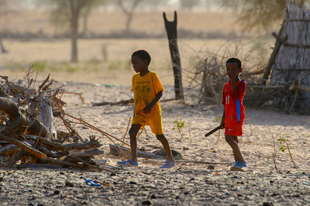FERLO DESERT, SENEGAL - APR 25, 2017: Unidentified Fulani children play in the yard. Fulanis (Peul) are the largest tribe in West African savannahsのeditorial素材