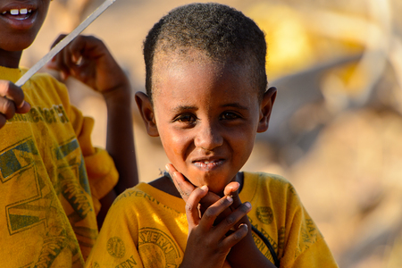 FERLO DESERT, SENEGAL - APR 25, 2017: Unidentified Fulani little boy looks ahead. Fulanis (Peul) are the largest tribe in West African savannahsのeditorial素材