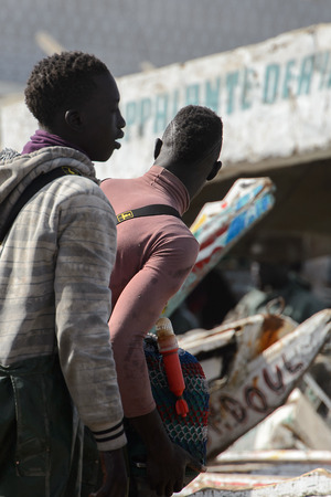 KAYAR, SENEGAL - APR 27, 2017: Unidentified Senegalese man looks ahead on the coast of the Atlantic Ocean. Many Kayar people work in portのeditorial素材