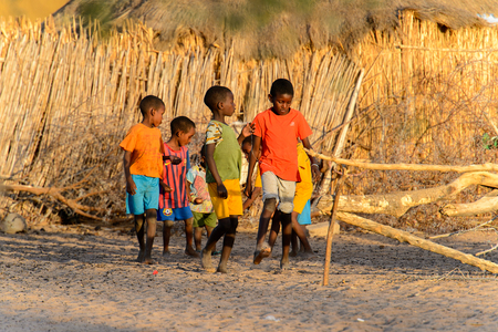 FERLO DESERT, SENEGAL - APR 25, 2017: Unidentified Fulani little children play on the yard in the village. Fulanis (Peul) are the largest tribe in West African savannahsのeditorial素材