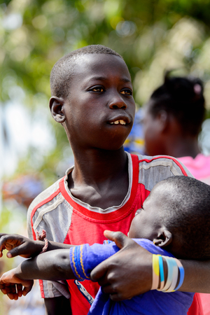 KASCHOUANE, SENEGAL - APR 29, 2017: Unidentified Diola boy looks away in Kaschouane village. Diolas are the ethnic group predominate in the region of Casamanceのeditorial素材