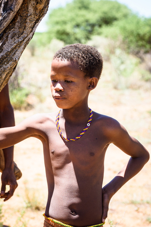 EAST OF WINDHOEK, NAMIBIA - JAN 3, 2016: Unidentified bushmen boy. Bushmen people are members of various indigenous hunter-gatherer people of Southern Africaのeditorial素材