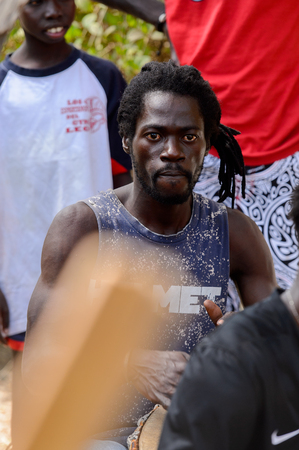 KASCHOUANE, SENEGAL - APR 29, 2017: Unidentified Diola man plays on drums in Kaschouane village. Diolas are the ethnic group predominate in the region of Casamanceのeditorial素材