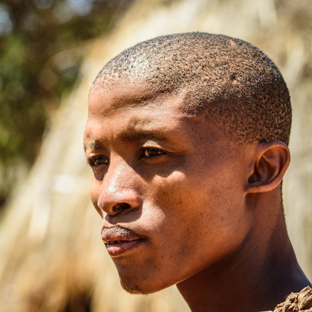 EAST OF WINDHOEK, NAMIBIA - JAN 3, 2016: Unidentified bushman man portrait. Bushman people are members of various indigenous hunter-gatherer people of Southern Africaのeditorial素材