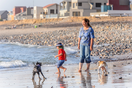 SWAKOPMUND, NAMIBIA - JAN 5, 2016: Unidentified tourists on the Atlantic coast of Swakopmund. It was found in 1892 as the main harbour for German South-West Africaのeditorial素材