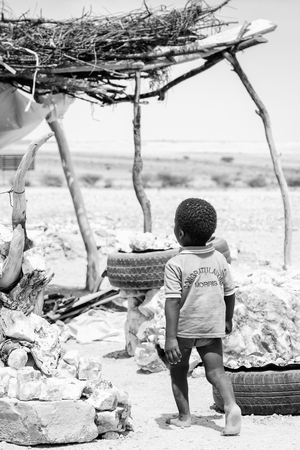 EAST OF WINDHOEK, NAMIBIA - JAN 3, 2016: Unidentified Ovambo little boy in Namibia.  Ovambo is the most popular ethnic groupのeditorial素材